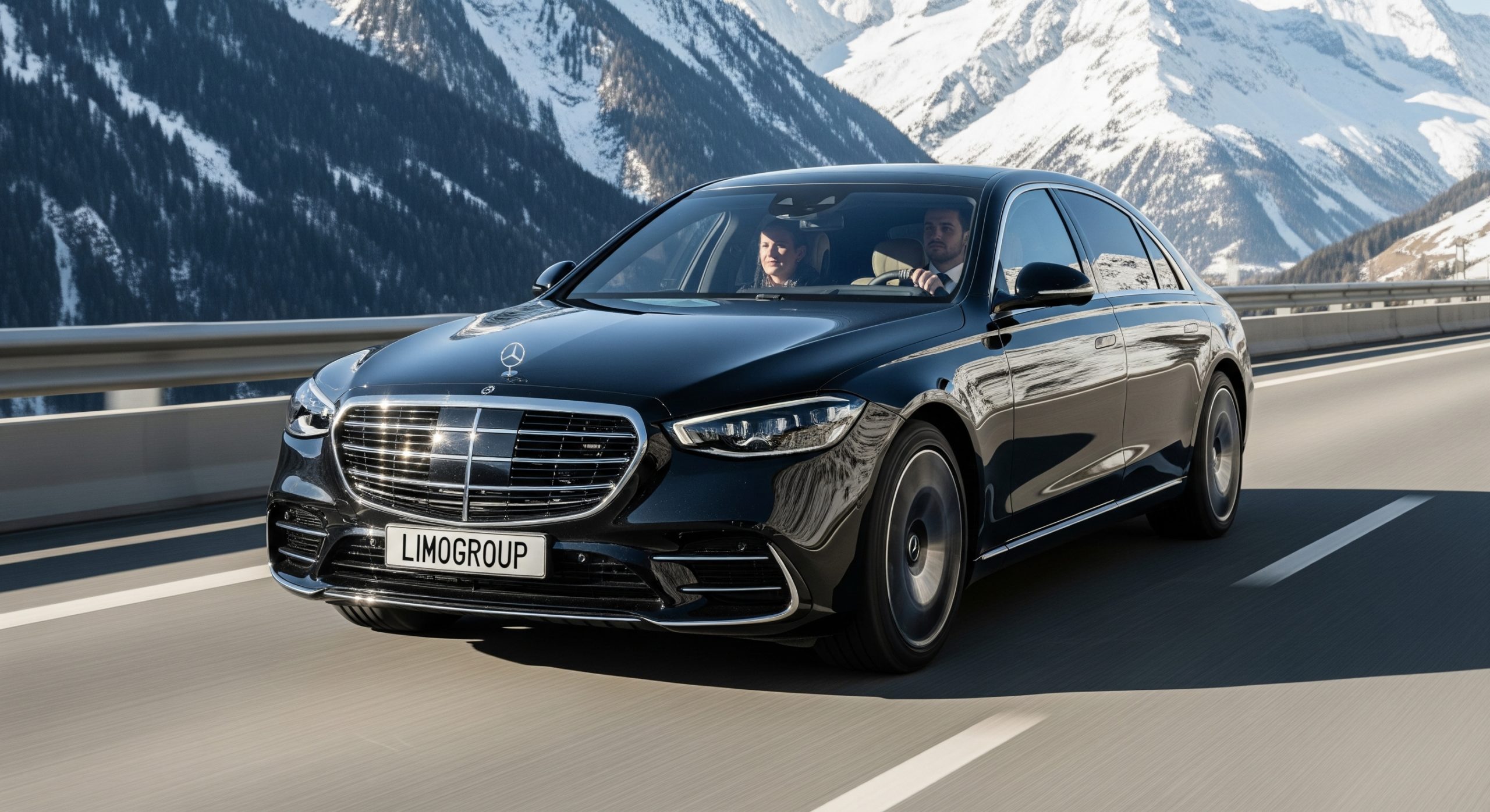 Latest black Mercedes S-Class 2025 from Limogroup, with 'LIMOGROUP' on its plate, driving on a sunny alpine highway, offering a luxurious Geneva to Chamonix private transfer as clients enjoy views.